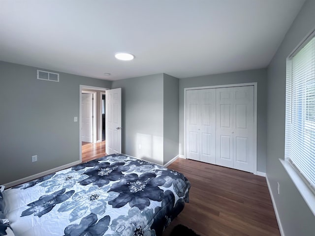 5098 N Center Rd, Flint, MI 48506 - bedroom with baseboards, wood finished floors, and multiple windows
