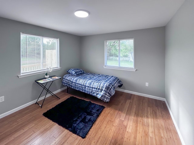 5098 N Center Rd, Flint, MI 48506 - bedroom featuring wood finished floors and baseboards
