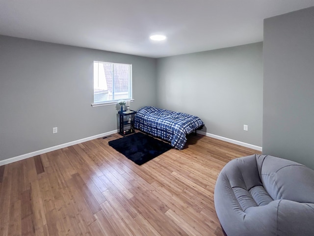 5098 N Center Rd, Flint, MI 48506 - bedroom featuring baseboards and wood finished floors