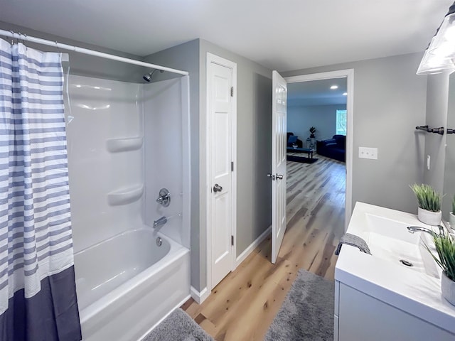 5098 N Center Rd, Flint, MI 48506 - bathroom with wood finished floors, shower / bath combo, vanity, and baseboards