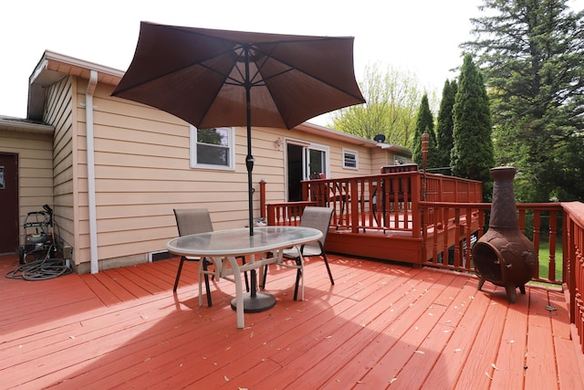 1029 N Linden Rd, Flint, MI 48532 - wooden deck with outdoor dining area