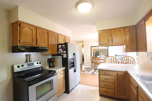 1029 N Linden Rd, Flint, MI 48532 - kitchen with stainless steel range with electric cooktop, under cabinet range hood, refrigerator with ice dispenser, light countertops, and a textured ceiling