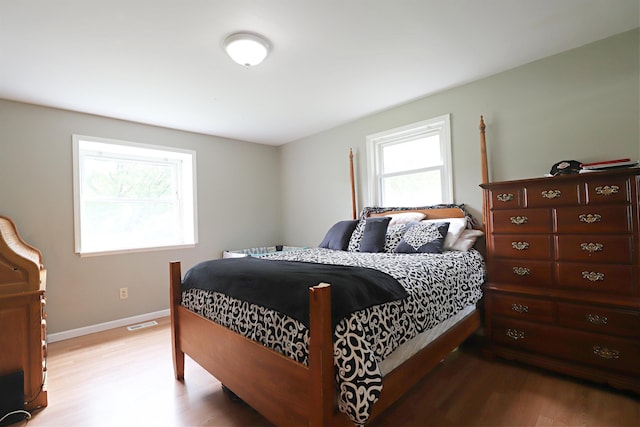 1029 N Linden Rd, Flint, MI 48532 - bedroom with light wood-type flooring and baseboards