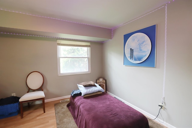 1029 N Linden Rd, Flint, MI 48532 - bedroom with baseboards and light wood finished floors