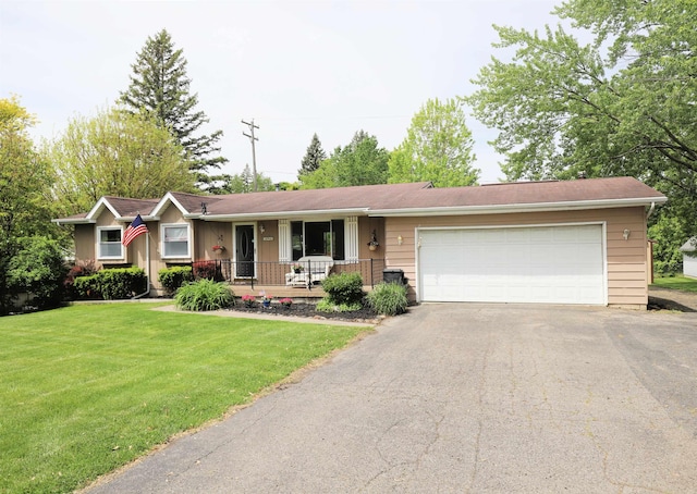 1029 N Linden Rd, Flint, MI 48532 - ranch-style house with driveway, an attached garage, a front lawn, and a porch