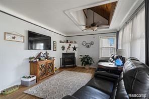1760 Cole St, Birmingham, MI 48009 - living room with a tray ceiling, wood finished floors, ceiling fan, and crown molding
