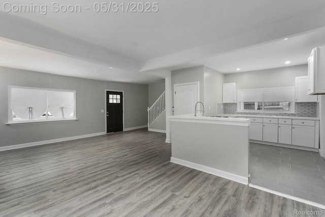 16565 Winston St, Detroit, MI 48219 - kitchen with backsplash, light countertops, white cabinets, recessed lighting, and open floor plan