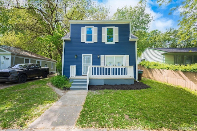 16565 Winston St, Detroit, MI 48219 - view of front facade with a front yard and a porch