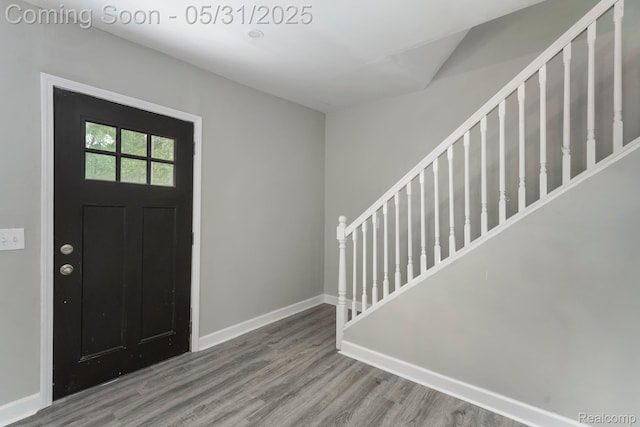 16565 Winston St, Detroit, MI 48219 - entrance foyer featuring wood finished floors, stairway, and baseboards