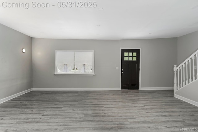 16565 Winston St, Detroit, MI 48219 - foyer with stairs, wood finished floors, and baseboards