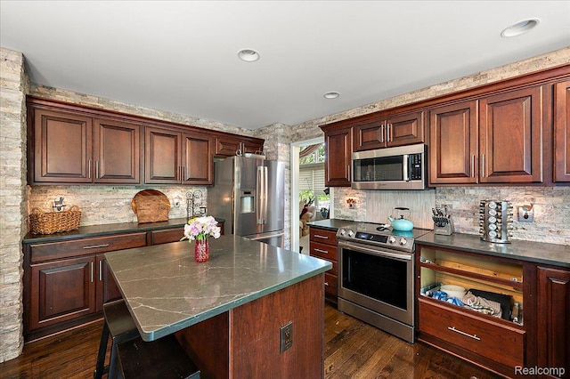 3796 Briarbrooke Ln, Rochester, MI 48306 - kitchen featuring appliances with stainless steel finishes, dark countertops, and backsplash