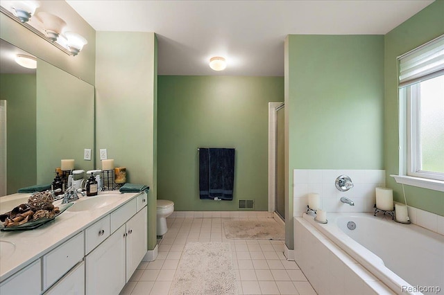 3796 Briarbrooke Ln, Rochester, MI 48306 - full bathroom with vanity, a bath, toilet, a stall shower, and tile patterned flooring