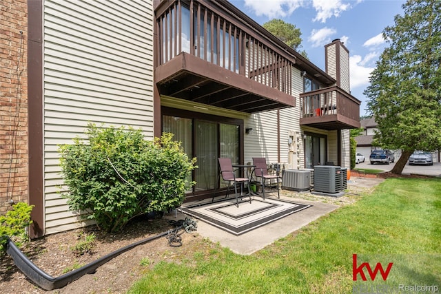 24327 Evergreen Rd, Southfield, MI 48075 - back of property with a balcony, central AC unit, and a yard
