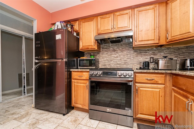 24327 Evergreen Rd, Southfield, MI 48075 - kitchen with stainless steel appliances, under cabinet range hood, and backsplash