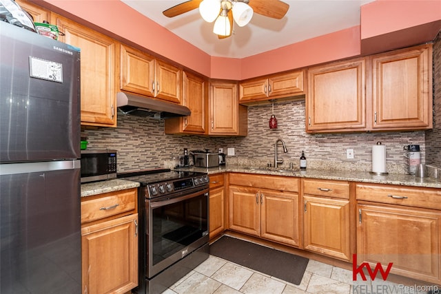 24327 Evergreen Rd, Southfield, MI 48075 - kitchen featuring under cabinet range hood, stainless steel appliances, a sink, a ceiling fan, and tasteful backsplash