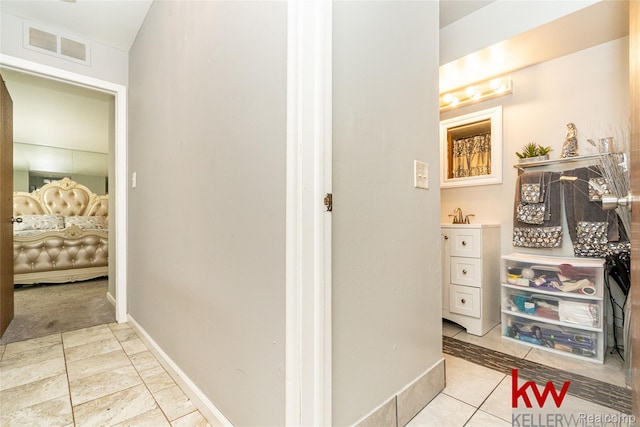 24327 Evergreen Rd, Southfield, MI 48075 - hall featuring a sink and baseboards