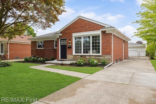 31111 Angeline Ct E, Saint Clair Shores, MI 48082 - view of front of property with a front lawn, brick siding, a gate, and a detached garage