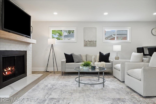 31111 Angeline Ct E, Saint Clair Shores, MI 48082 - living room with wood finished floors, a fireplace, recessed lighting, and baseboards