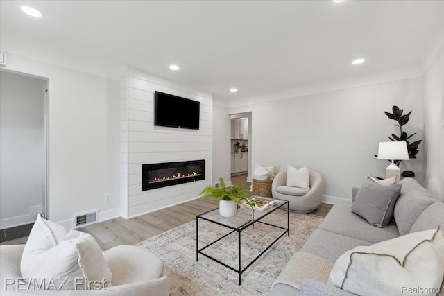 31111 Angeline Ct E, Saint Clair Shores, MI 48082 - living room featuring a fireplace, recessed lighting, wood finished floors, and baseboards