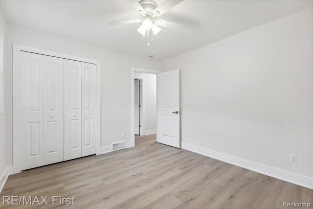 31111 Angeline Ct E, Saint Clair Shores, MI 48082 - unfurnished bedroom with wood finished floors, baseboards, a closet, and ceiling fan