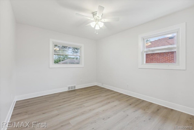 31111 Angeline Ct E, Saint Clair Shores, MI 48082 - spare room with light wood-style flooring, baseboards, and a ceiling fan
