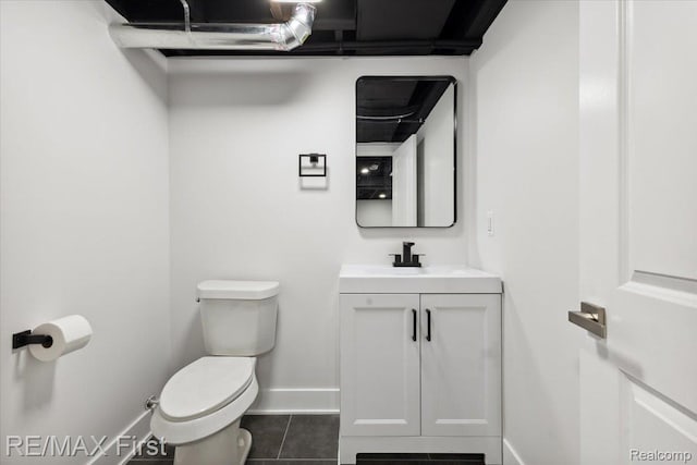 31111 Angeline Ct E, Saint Clair Shores, MI 48082 - half bath with toilet, vanity, baseboards, and tile patterned flooring