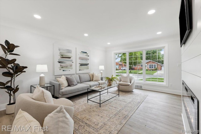 31111 Angeline Ct E, Saint Clair Shores, MI 48082 - living area featuring wood finished floors, recessed lighting, and baseboards