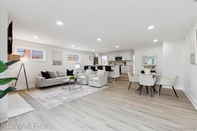 31111 Angeline Ct E, Saint Clair Shores, MI 48082 - living area featuring light wood-type flooring, plenty of natural light, recessed lighting, and baseboards