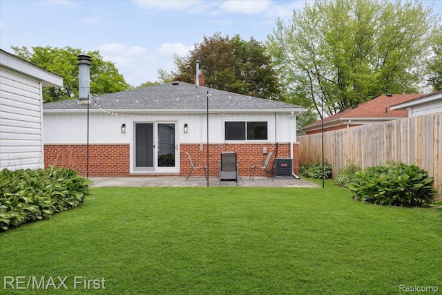 31111 Angeline Ct E, Saint Clair Shores, MI 48082 - back of house featuring brick siding, a patio area, roof with shingles, and central air condition unit