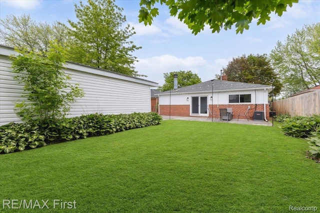 31111 Angeline Ct E, Saint Clair Shores, MI 48082 - back of house with a patio area, brick siding, and a chimney