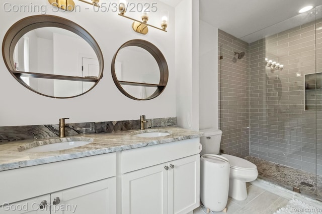 2520 Ellwood Ave, Berkley, MI 48072 - bathroom featuring toilet, double vanity, and tiled shower