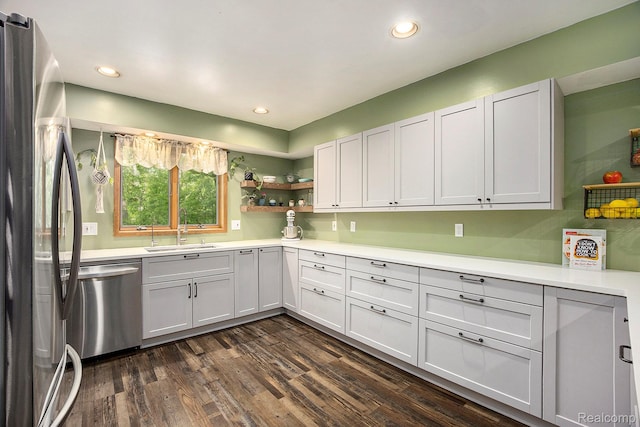 1295 Kern Rd, Oakland, MI 48363 - kitchen with appliances with stainless steel finishes, a sink, dark wood-style floors, light countertops, and recessed lighting