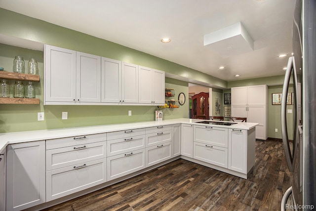 1295 Kern Rd, Oakland, MI 48363 - kitchen featuring freestanding refrigerator, recessed lighting, a peninsula, dark wood-type flooring, and light countertops