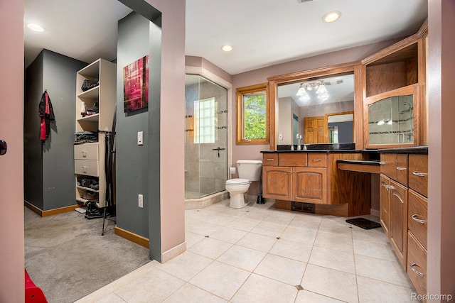 1295 Kern Rd, Oakland, MI 48363 - full bath with a shower stall, vanity, toilet, tile patterned floors, and baseboards