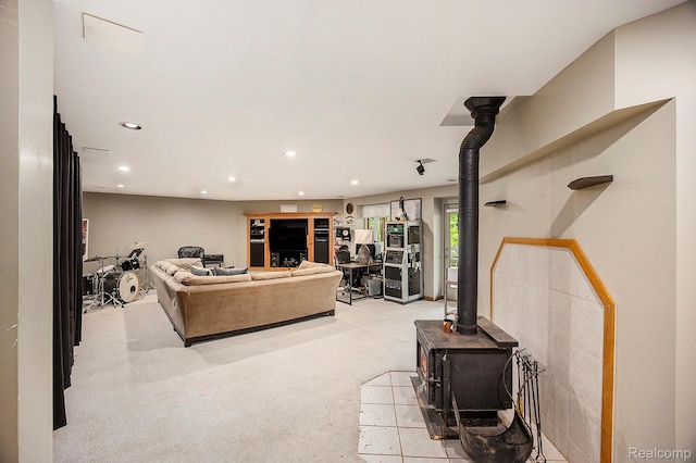 1295 Kern Rd, Oakland, MI 48363 - living area featuring recessed lighting, a wood stove, and light carpet