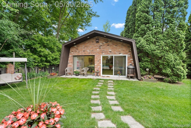 9495 Continental Dr, Taylor, MI 48180 - rear view of property with brick siding and a patio