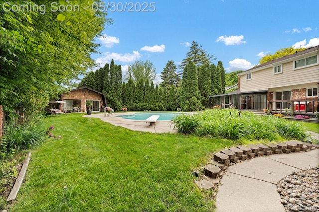 9495 Continental Dr, Taylor, MI 48180 - view of grassy yard featuring an outdoor pool, an outbuilding, and a sunroom