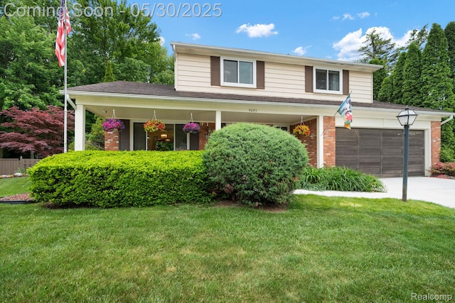 9495 Continental Dr, Taylor, MI 48180 - view of front facade with brick siding, driveway, a front yard, and covered porch