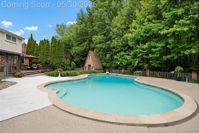 9495 Continental Dr, Taylor, MI 48180 - view of swimming pool with a wooden deck and a patio