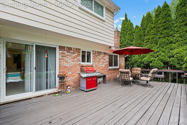 9495 Continental Dr, Taylor, MI 48180 - deck featuring outdoor dining space and a grill