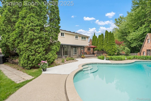 9495 Continental Dr, Taylor, MI 48180 - swimming pool featuring a deck and a sunroom