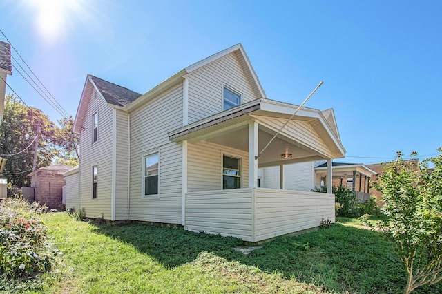 224 Spencer St NE, Grand Rapids, MI 49505 - view of property exterior featuring a lawn