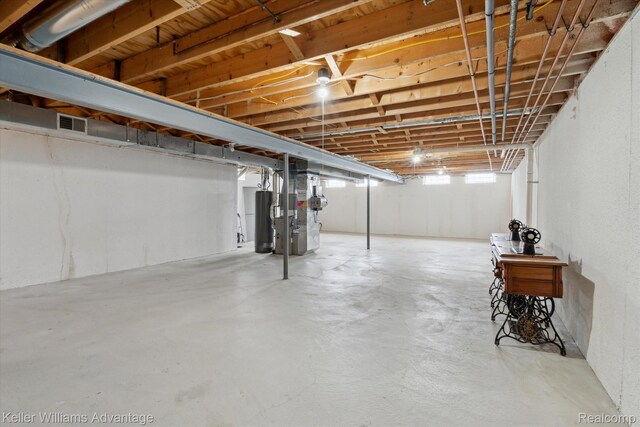 48727 Aberdeen Ct, Shelby Twp, MI 48315 - basement featuring water heater and heating unit
