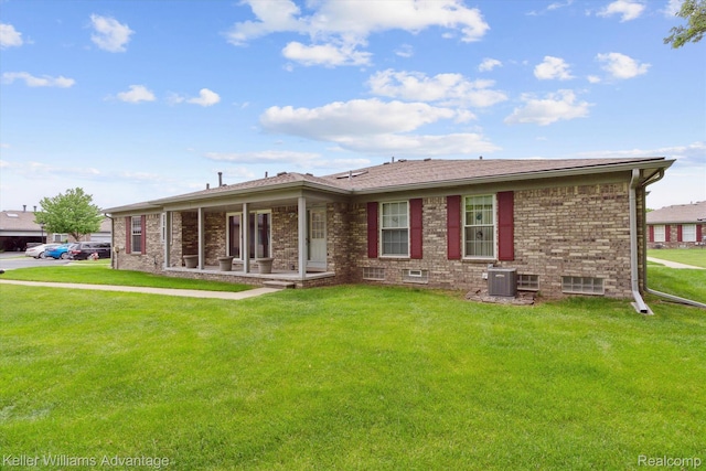 48727 Aberdeen Ct, Shelby Twp, MI 48315 - view of front of home featuring a front yard, brick siding, and central air condition unit