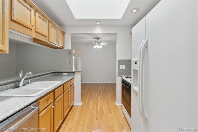 48727 Aberdeen Ct, Shelby Twp, MI 48315 - kitchen with white appliances, recessed lighting, a ceiling fan, light wood finished floors, and a sink