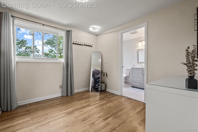 1916 Squirrel Valley Dr, Bloomfield Hills, MI 48304 - unfurnished bedroom with light wood-type flooring, baseboards, and ensuite bathroom