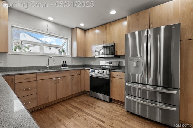 1916 Squirrel Valley Dr, Bloomfield Hills, MI 48304 - kitchen with appliances with stainless steel finishes, a sink, light wood finished floors, and recessed lighting