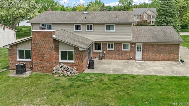 1916 Squirrel Valley Dr, Bloomfield Hills, MI 48304 - back of house featuring a patio, a lawn, and a chimney
