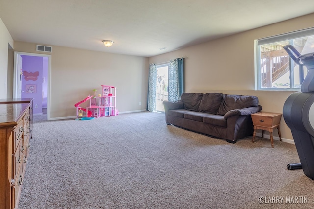 709 Wild Flower Dr, Wayland, MI 49348 - living room featuring carpet floors and baseboards