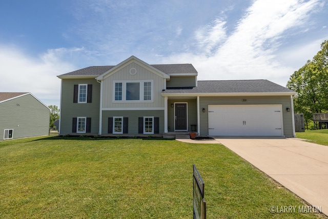 709 Wild Flower Dr, Wayland, MI 49348 - tri-level home featuring board and batten siding, an attached garage, concrete driveway, and a front lawn